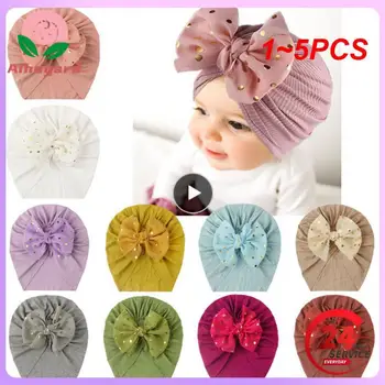 1 ~ 5PCS Прекрасна лъскава бебешка шапка Bowknot Сладка плътен цвят Бебе Момчета Шапка Тюрбан Меко новородено бебе